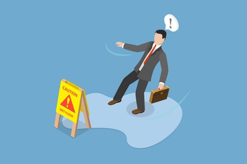 Vorsicht, Unfallgefahr Die Illustration zeigt eine Wasserpfütze auf dem Boden mit einem Warnschild "Vorsicht, nasser Boden, Sturzgefahr" und einen Mann mit Aktentasche, der sich erschreckt und gerade ausrutscht.